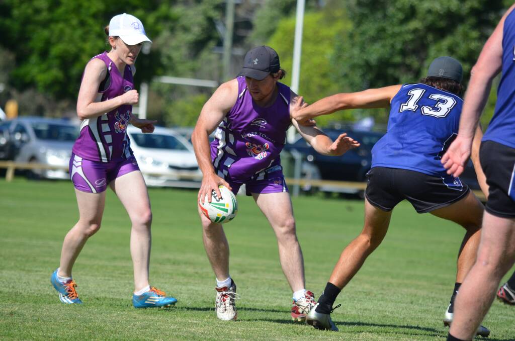 PLAY IT QUICK: Sally Whiting and Jono George made up a strong Mudcrabs outfit during their NSW Touch State Cup campaign. Photo: Supplied