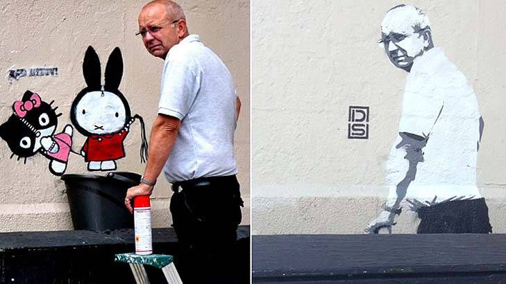 DS found his 'Bad Kitty' graffiti being removed just eight hours after he had finished the work. Photo: DS/Caters