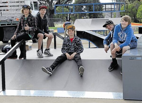 IN WITH THE NEW: Watching  with great interest as the crew from Sk8Scape put together the new skate park at Gulgong last Friday and ready to try it out. (From left) Ben Cooper, Blake Hansen, Brayden Lane, Cody Jones and Kyle Loughery.	080712/GulgongNewSkatePark/0498