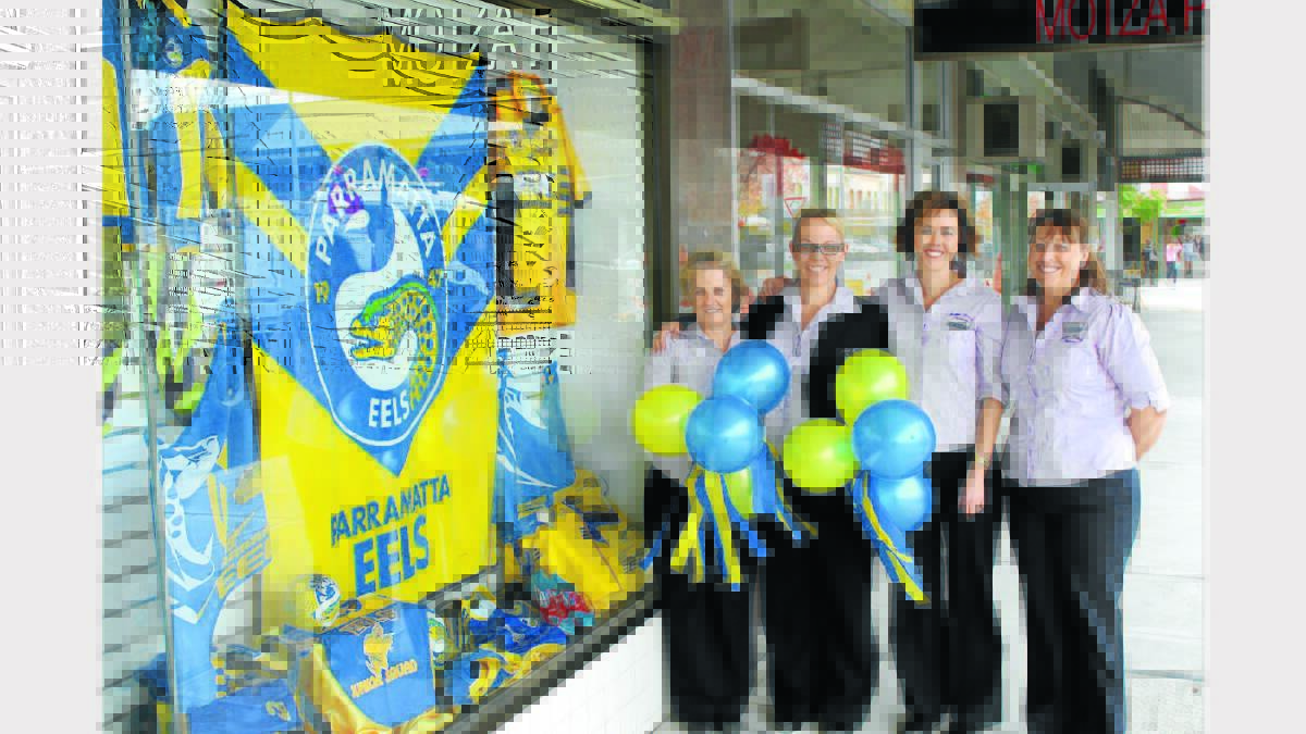 BLUE AND GOLD: Sally Bryant, Anna Craig, Lindy Tattersall and Leanne Innes of Mudgee Friendly Pharmacy with their competition winning window display. 230513/SPSHOPFRONTS/MUDGFRIENDPHARM/007