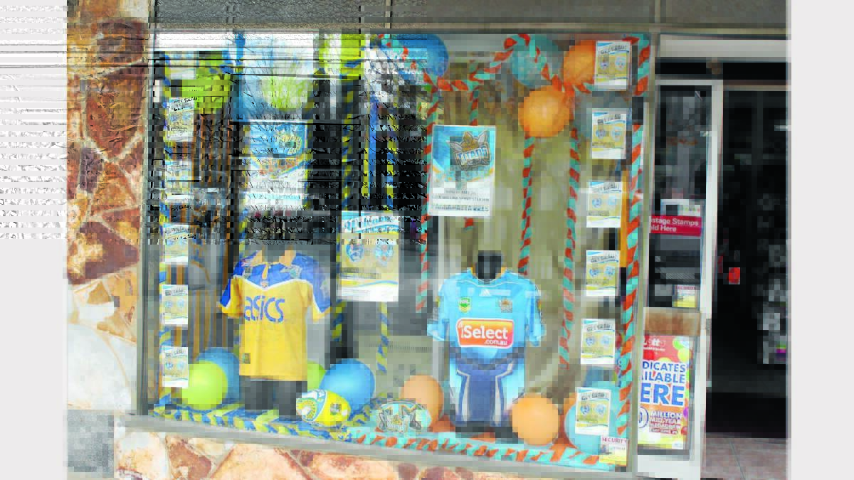EVEN COVERAGE: Mudgee Newsagency’s display consisted of both teams’ jerseys. 230513/SPSHOPFRONTS/SHOPS005