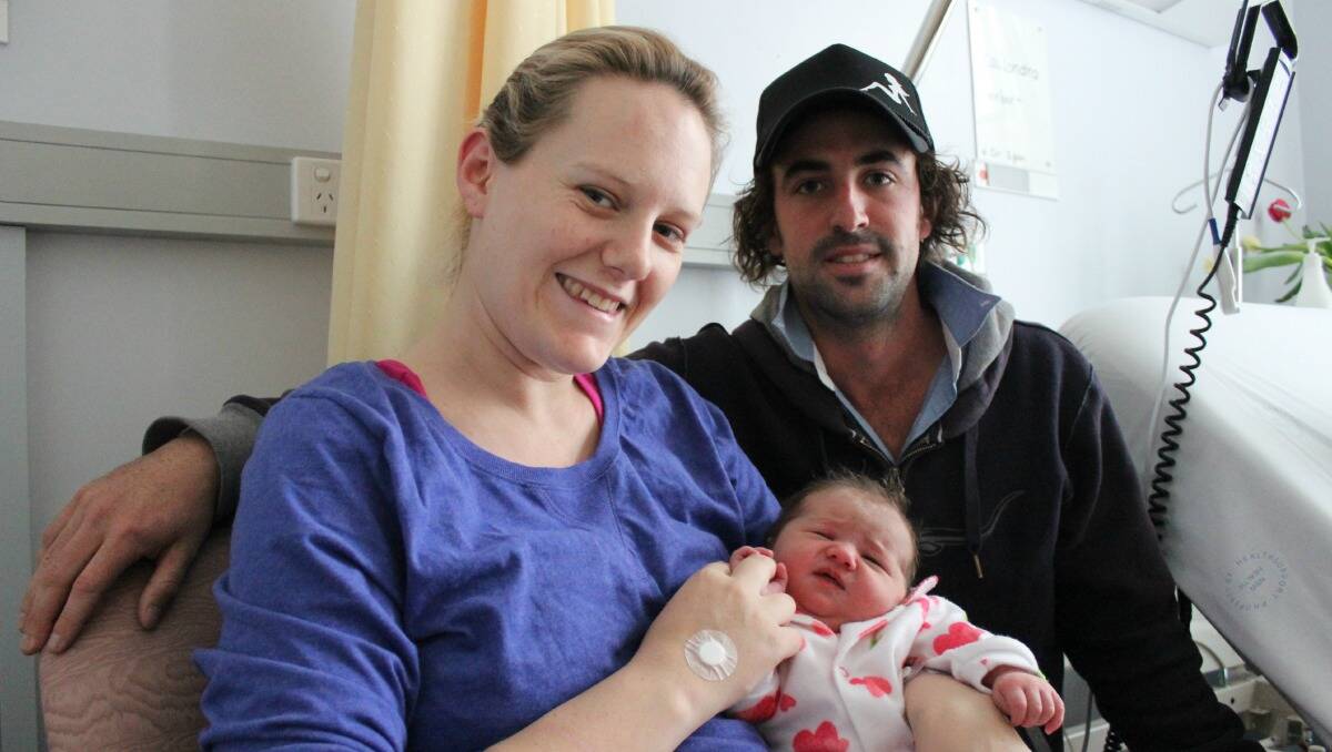 Cassi and Matt Barton with their first daughter Imogen who was born on Monday. Imogen will now share the same birthday as the newly born British prince. PHOTO: DARREN SNYDER 230713/dsbaby/5926