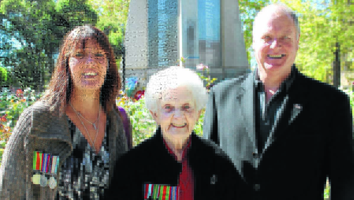 THE LAST WELLS: Laura McMillan (nee Wells) stands in front of the Mudgee Cenotaph with her children Kirsteen and Stuart. Laura is the last surviving grandchild of one of Mudgee’s early  entrepreneurs, H.E.A. Wells.