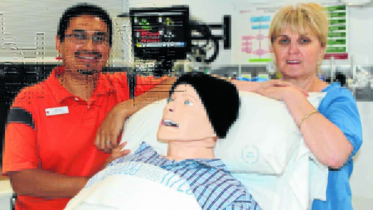 Mobile Simulation Centre educators Jaime Coello and Pauline Webster use “George” the simulation mannequin to help train hospital staff across NSW.