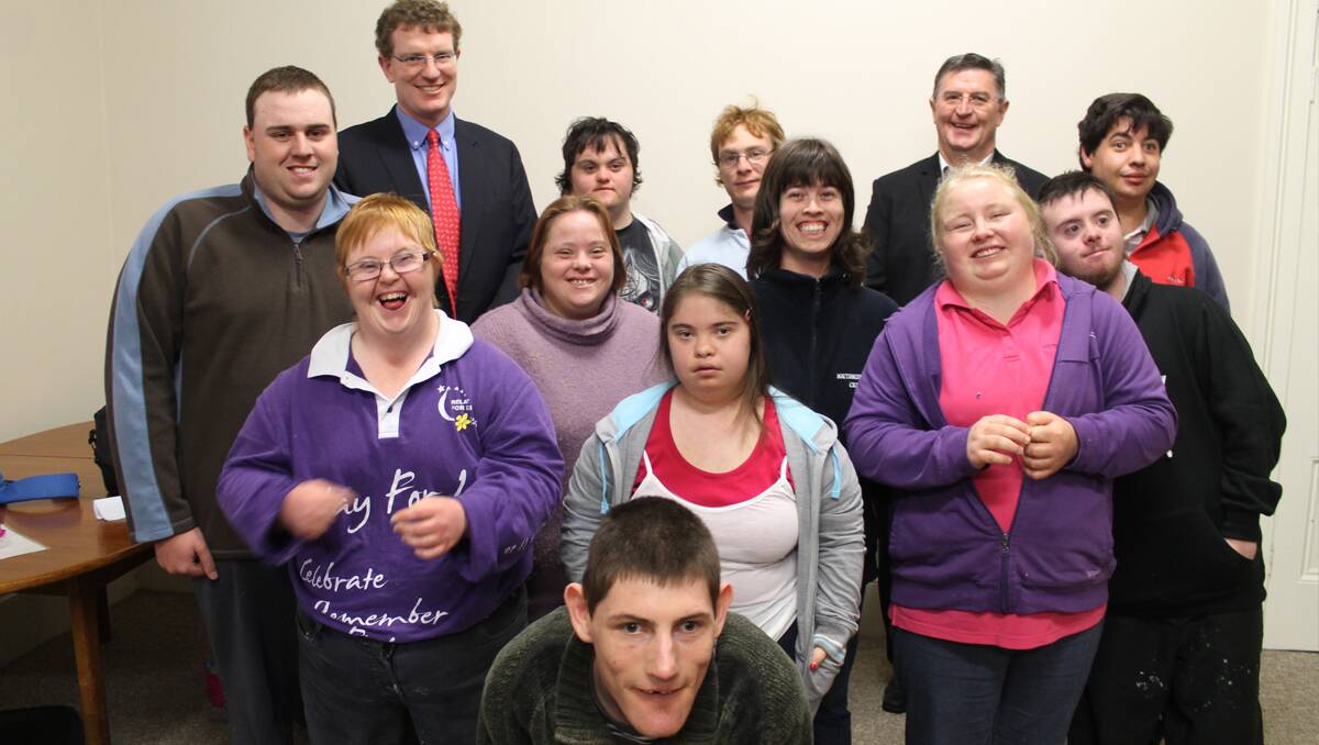 Andrew Gee and Des Kennedy celebrate the announcement of funding for a new Lifeskills centre with (back row) Chris Rushworth, Daniel Salter, Jonathan Day, Sam Naake, (middle row) Erin Walker, Hailey Olive, Jesse Plant, Nichole Murray, Teriley Hodge, Cameron Lingard and (front) Ben Illsley.	