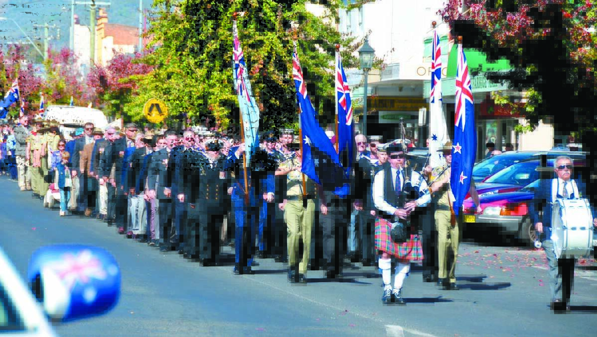 The Anzac parade makes its way down Church Street, Mudgee, on their way to Robertson Park yesterday.	