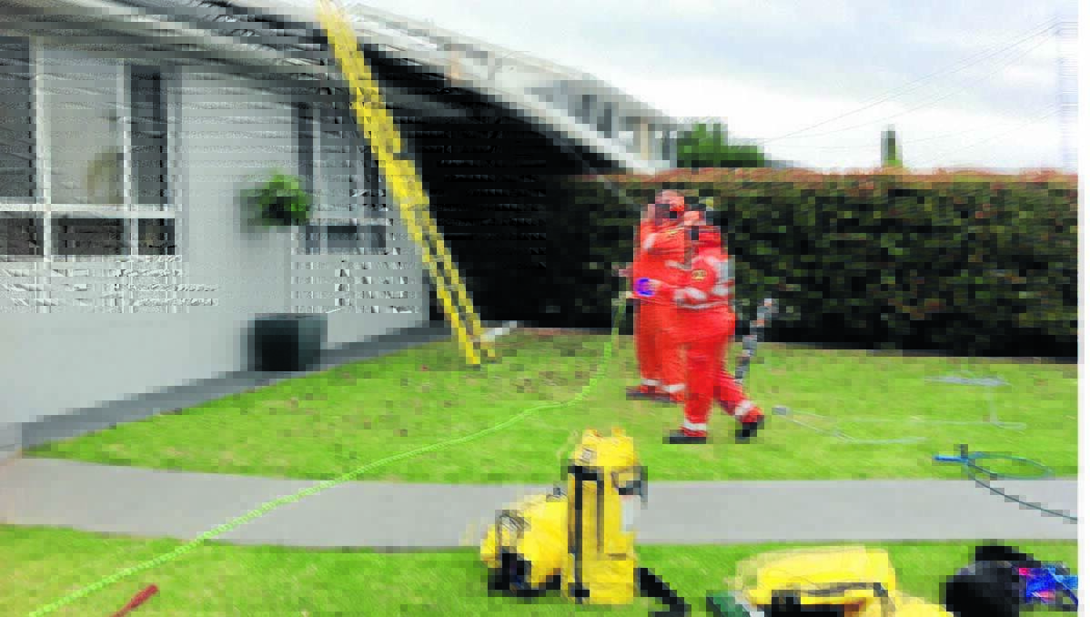 RESPONSE: Local SES volunteers attend a callout caused by the windy weather in mid-October. The First three months of storm season - October, November and December - accounted for around half of the unit's callouts for the entire 2013.