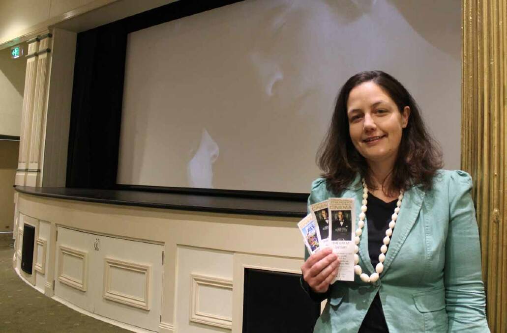 COMING SOON TO A SCREEN NEAR YOU: Mid-Western Regional Council community services manager Kate Power holds the first tickets for movies at the Mudgee Town Hall Theatre. 