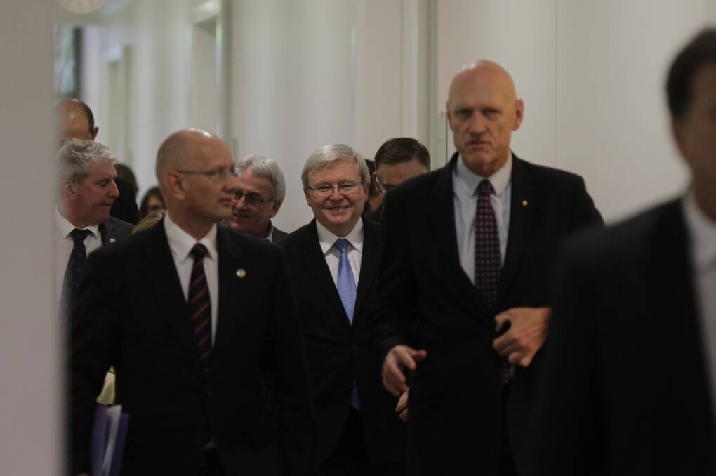 Kevin Rudd and colleagues leave the Caucus meeting at Parliament House in Canberra. Photo: Fairfax Media