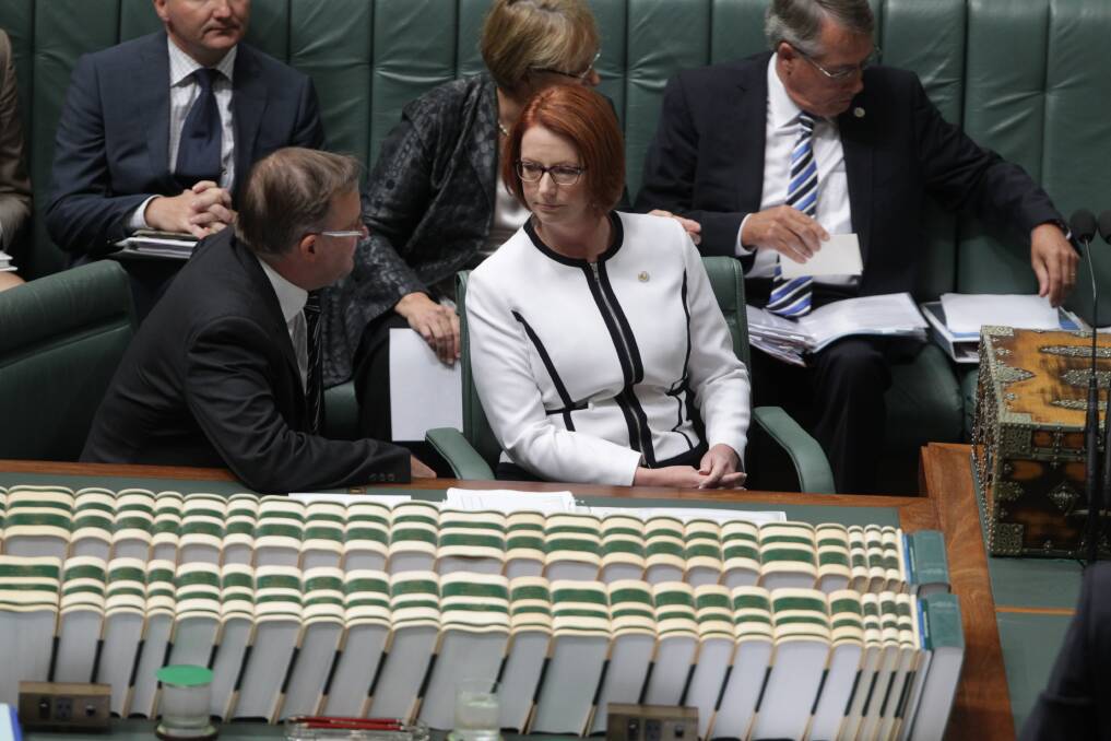 Leader of the House Anthony Albanese in discussion with Prime Minister Julia Gillard during question time. Photo: Fairfax Media