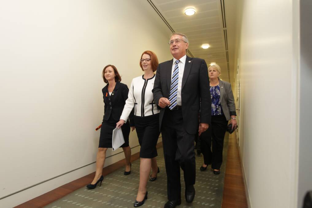 Prime Minister Julia Gillard confidently walks to the Caucus meeting. Photo: Fairfax Media