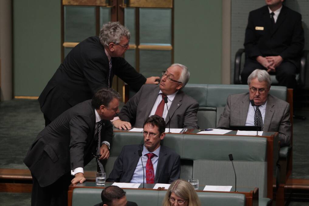 Chief Government Whip Joel Fitzgibbon speaks with Labor backbenchers during Question Time, at Parliament House in Canberra. Photo: Getty Images
