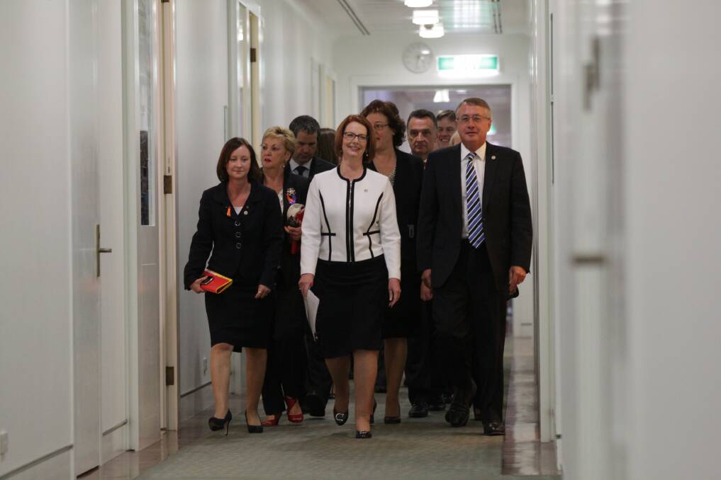 Prime Minister Julia Gillard confidently walks to the Caucus meeting. Photo: Fairfax Media