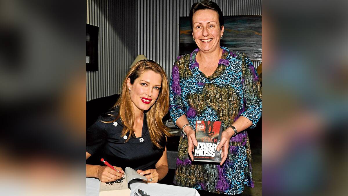 Tara Moss signs her novel for Beth Mill  of Dubbo who received her ticket to the Festival lunch as a birthday present.