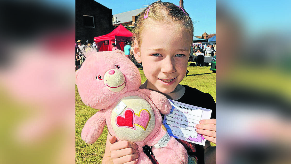 Olivia Hopson with the birth certificate issued to ‘Love a Lot’. 	270413SS/TeddyBearsPicnic/1441