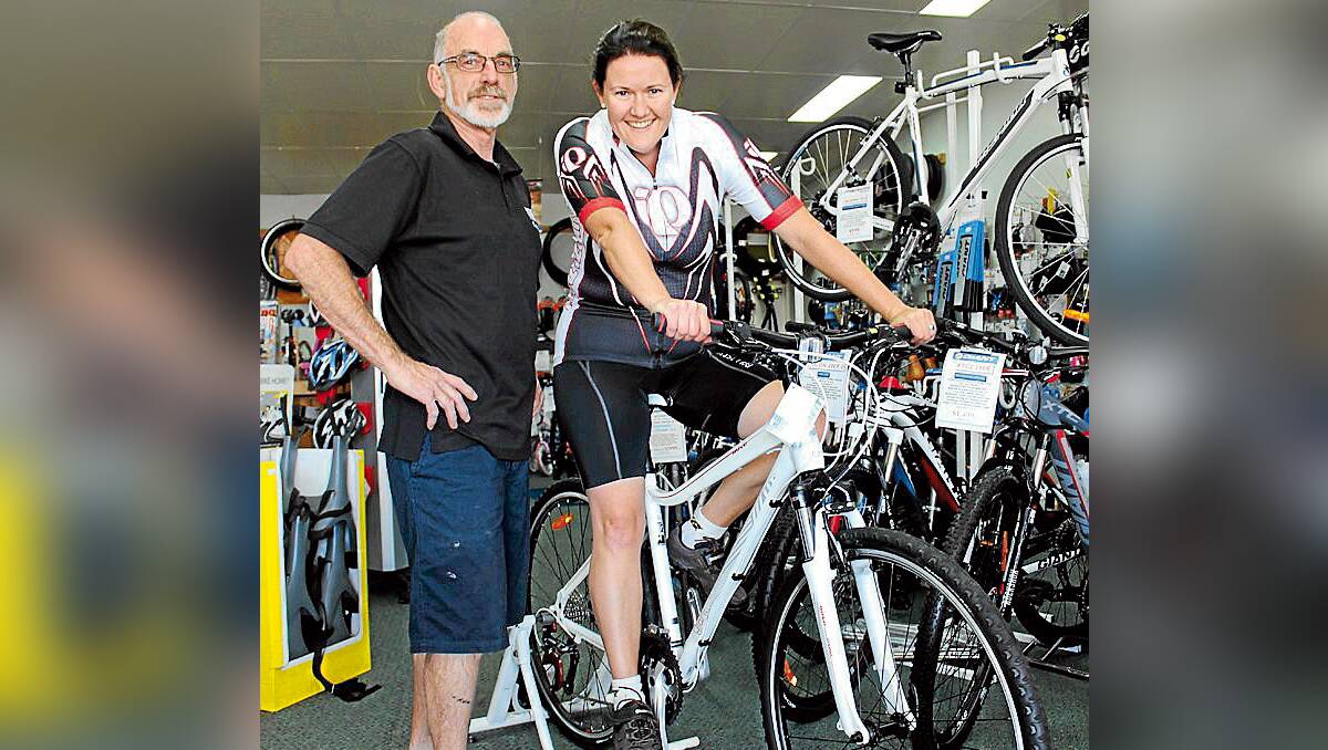 CHARITABLE TEAM: Ian Morgan of Mudgee Cycles is sponsoring Canowindra’s Jane Atkinson to ride across Vietnam and Cambodia in November. Ms Atkinson is raising funds for Arthritis NSW.	PHOTO BY DARREN SNYDER 040213/dsJaneAtkinson/3987