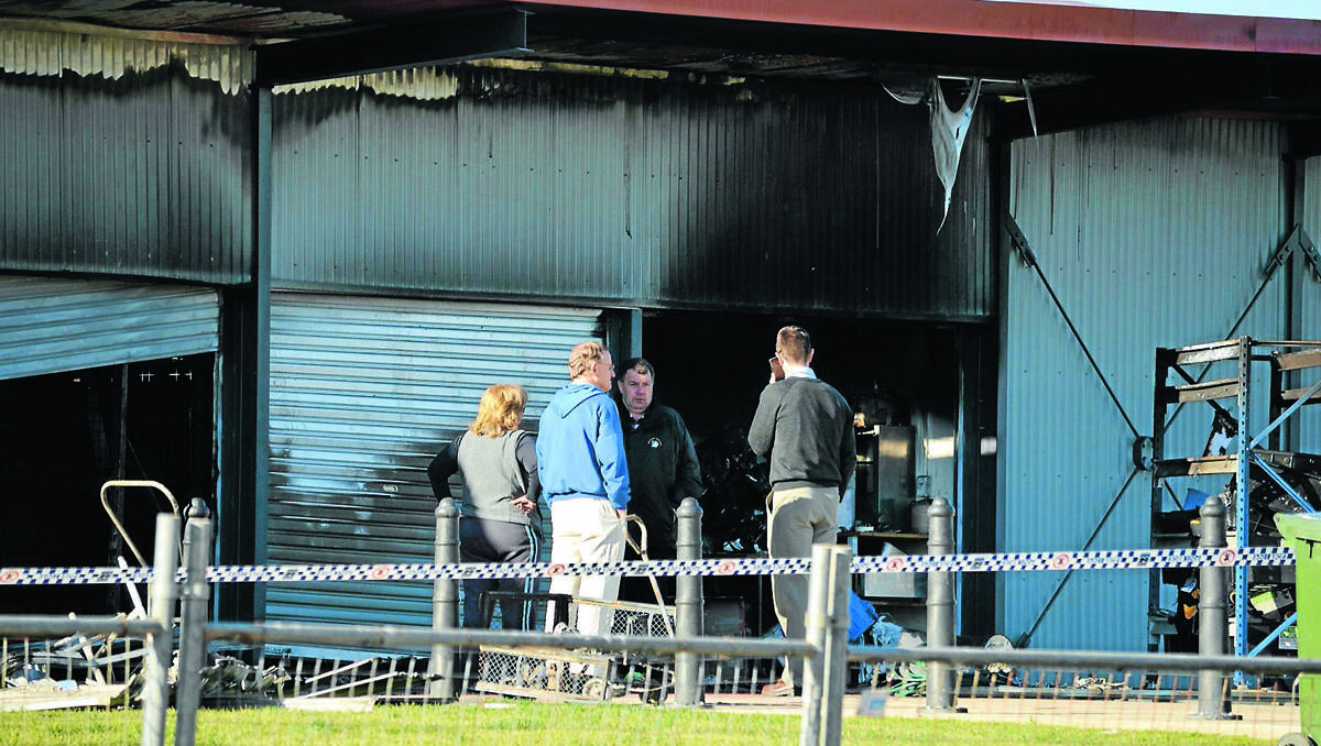 DEVASTATED: Mudgee Touch and Rugby League secretary Kathy Lang, Mudgee Touch treasurer Jim Yeo, Mudgee Wolves and Sports Council president Peter Mitchell, and Mid-Western Regional Council’s business manager resources and recreation Julian Geddes view the damage to their respective store rooms following Monday morning’s fire at Glen Willow. Photo: BEN HARRIS 