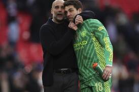 Pep Guardiola was indebted to substitute No.1 Stefan Ortega after his display against Spurs. (AP PHOTO)