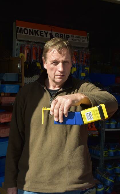 FED UP: Allan McSewyn holding a 'rocket trap', which is one of many devices he has used to slow down the mice plague. Photo: Nicolas Zoumboulis