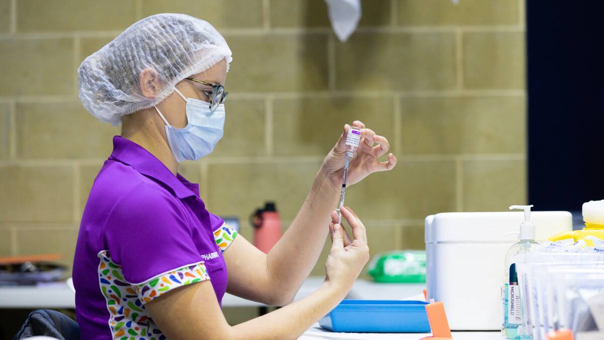A nurse fills a syringe with the AstraZeneca vaccine in Perth as part of the vaccine rollout. Picture: AAP