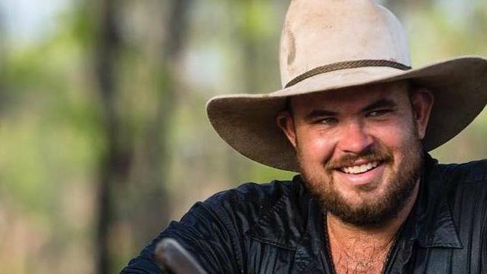 An arrest warrant has been issued following an ongoing investigation into the helicopter crash in West Arnhem Land in February that killed Outback Wrangler star Chris 'Willow' Wilson.