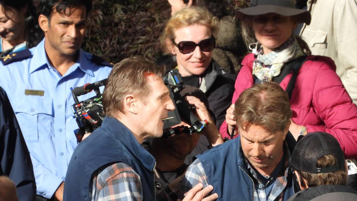 Liam Neeson with cast and crew on the set of The Ice Road 2 in Walhalla, Victoria. Picture by Lance Malone