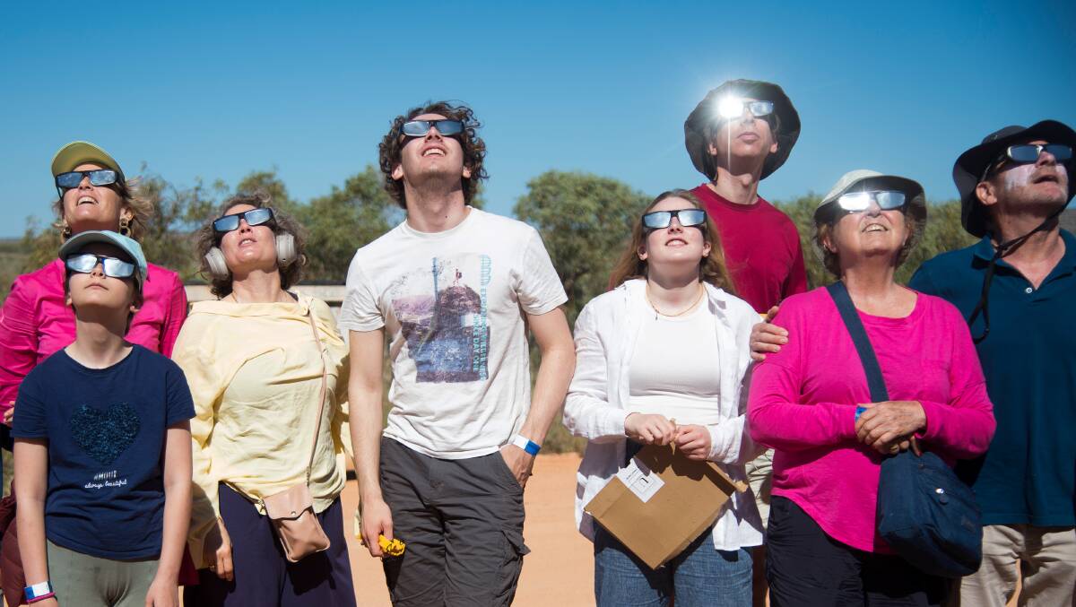 People gather for the total solar eclipse at a viewing site 24km from Exmouth, Western Australia, on April 20, 2023. Picture by AAP Image/Aaron Bunch