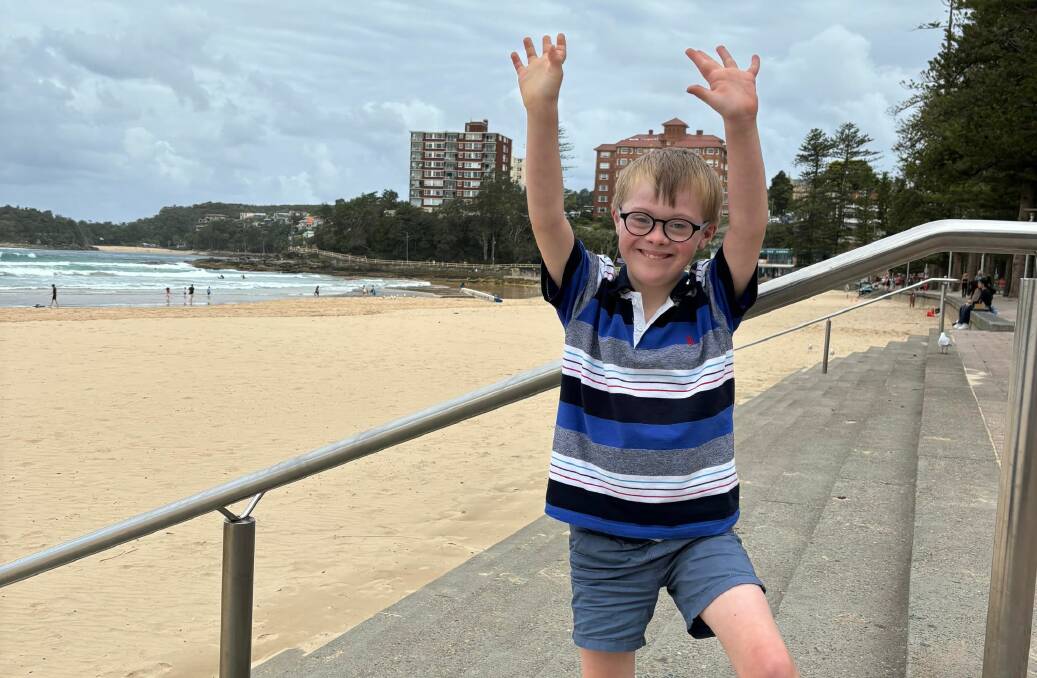 Charlie spending time at the beach. Picture supplied by Down Syndrome NSW 