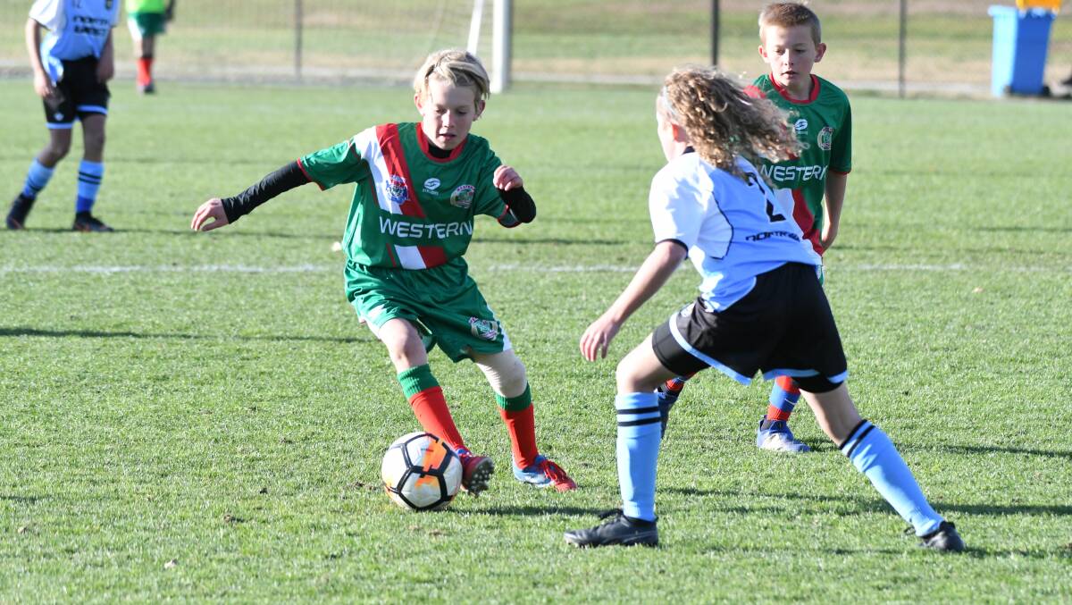 Action from the NSW PSSA Boys Football Carnival between Western and North West. Photos: CHRIS SEABROOK