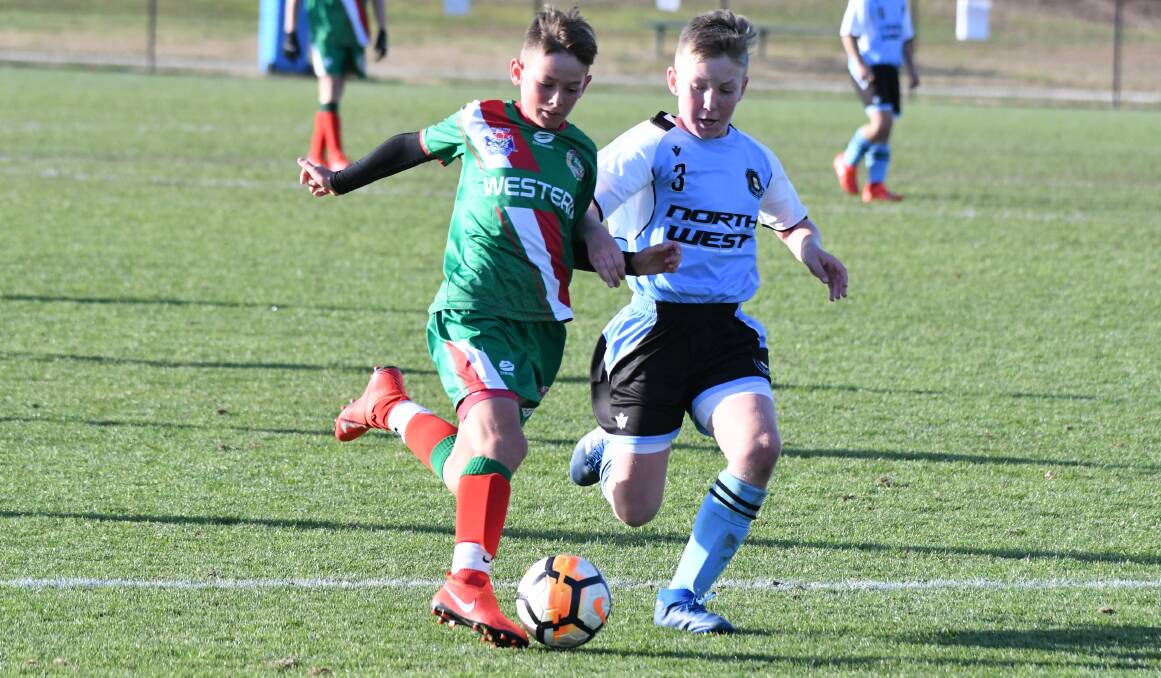 ON THE BALL: Mudgee Public School student Archie Clulow in action for Western in the NSW PSSA Football Carnival. Photo: Chris Seabrook
