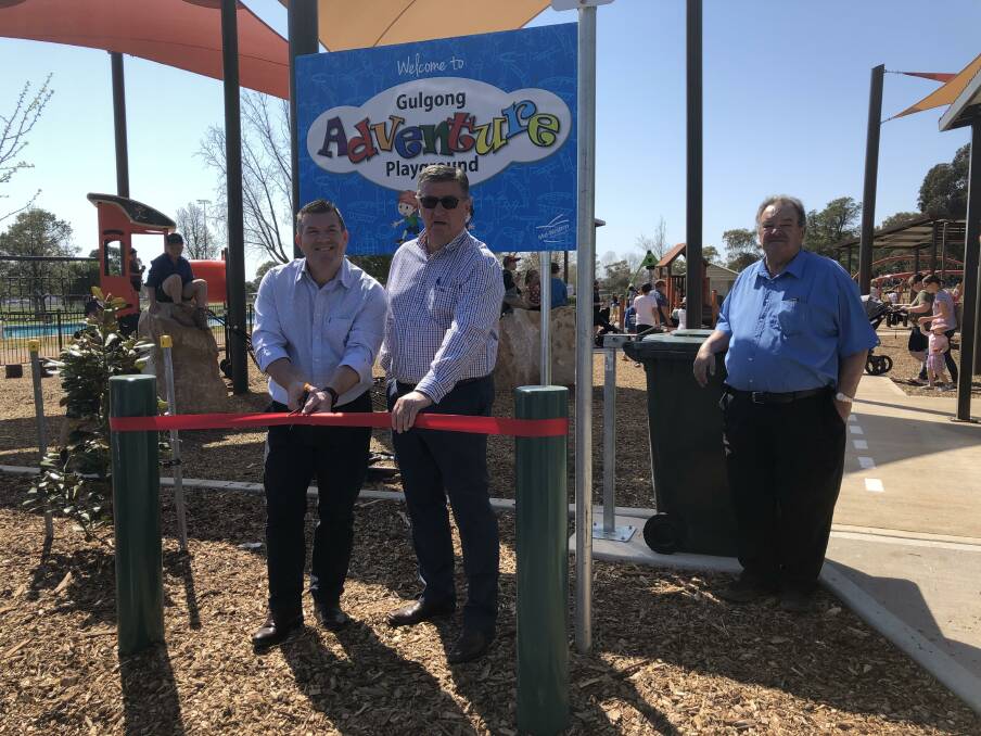 Opening of Adventure Park: Dugald Saunders on left and Mayor Des Kennedy right and Percy Thompson far right cutting the ribbon to declare the park open.