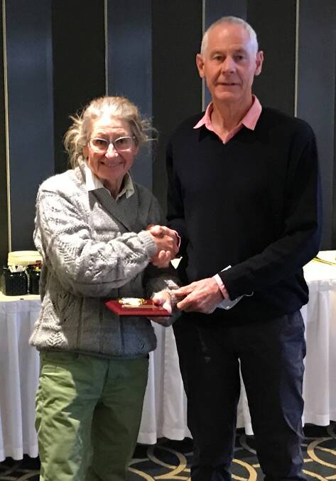Carolyn Sheehan is presented with her life membership from fellow life member Greg Griffith. 