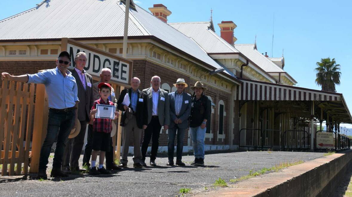 Mudgee Region Passenger Rail Inc members with locals Adam (front) and Simone Kurtz (right) at the Mudgee platform. Picture by Jay-Anna Mobbs 
