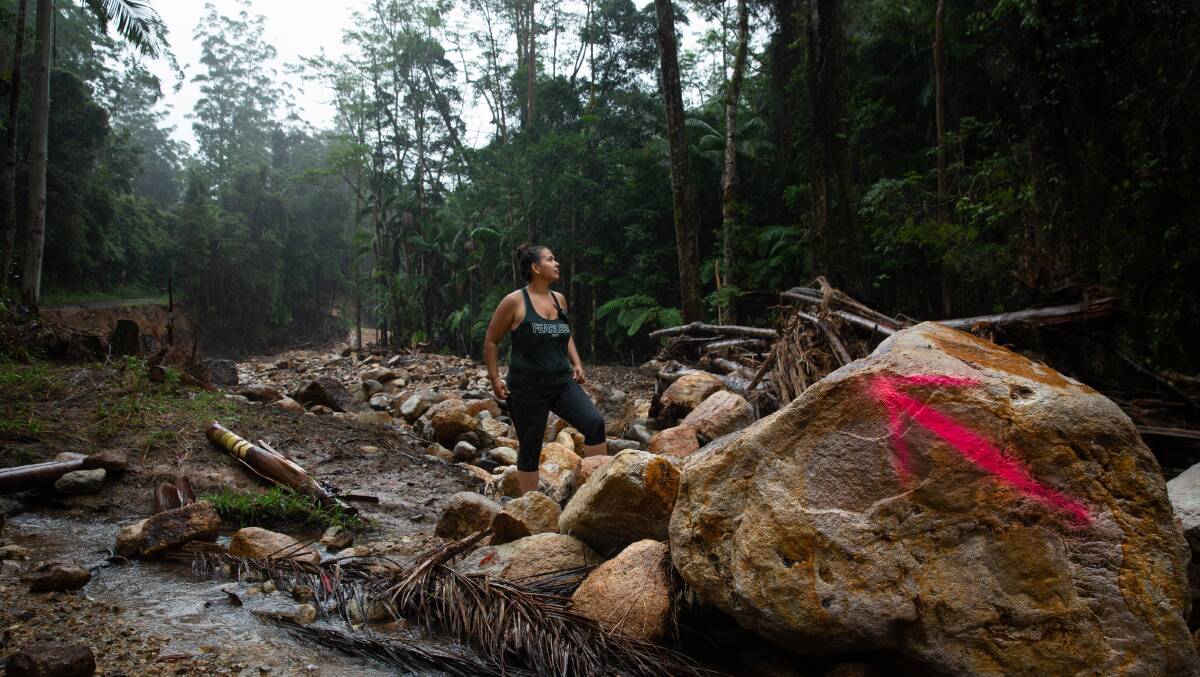Caileigh Toupin on the treacherous track carved out of the landslide to give Huonbrook residents access to the outside world. 