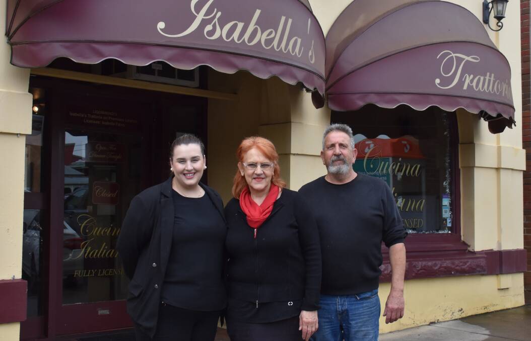 22 YEARS: Simona, Isabella and John Falvo in front of Isabella's Trattoria. Picture: JAY-ANNA MOBBS
