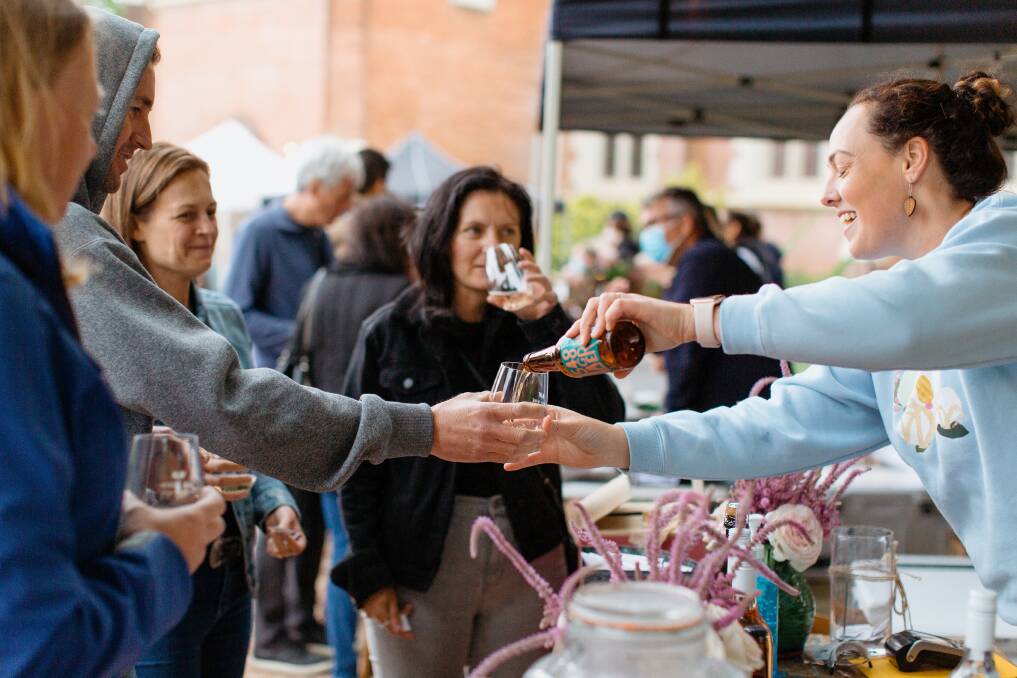 Mudgee Wine and Food Month attendees receive a product from Burnbrae Wines at the twilight tasting in November 2021. Picture: Marianna Photography