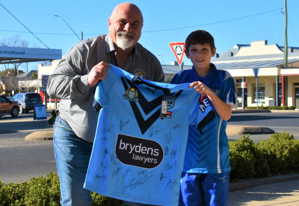 District vice president of the Mining and Energy Union south Western district, Craig Carberry and Calen Webster with the signed jersey. Picture: Jay-Anna Mobbs