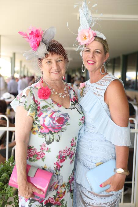 RACE DAY: Trish Ward and Carmen Holden-Smith dressed in pink as part of Pink Up for Mudgee Race Club. Photo: Simone Kurtz