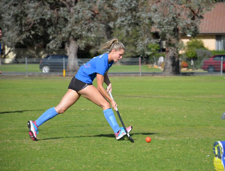 BOOSTING NUMBERS: Emma Hislop pictured in last years hockey season, ahead of talks to boost numbers in Mudgee. Photo: Supplied