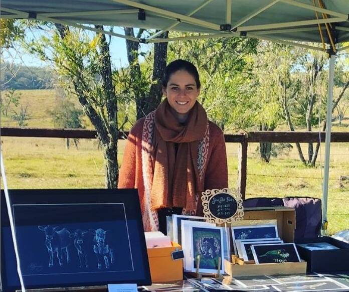 ARTIST: Lisa Kennedy pictured selling some of her artwork at a market. Photo: Supplied