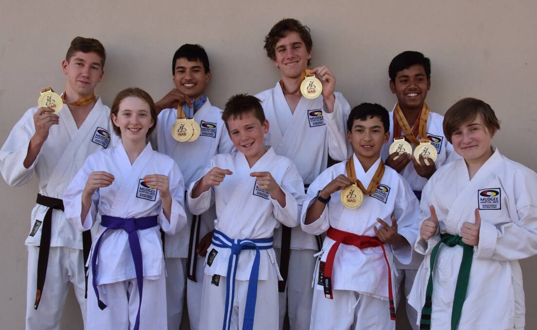 WRAPPING IT UP: Mudgee Martial Arts students, (back) Hayden Lowe, William Drakeford, Jack Newman, Arnab Ghosh, (front) Ashley Maher, Liam Standen, Allen Drakeford, Jesskia Newman, made the trek to Melbourne to compete in the National All Styles Nationals Championships late last month. Photo: Jay-Anna Mobbs