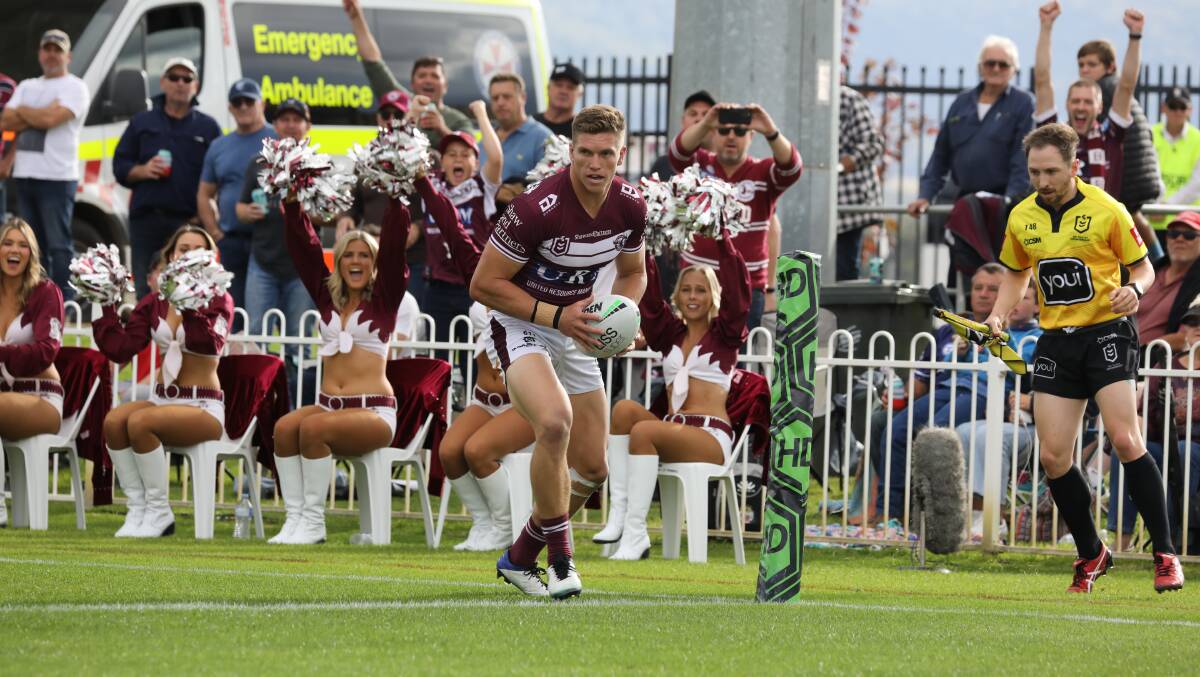 TRY TIME: Manly's Reuben Garrick going for a try during this year's clash against the Gold Coast Titans at Glen Willow Stadium. Picture: SIMONE KURTZ