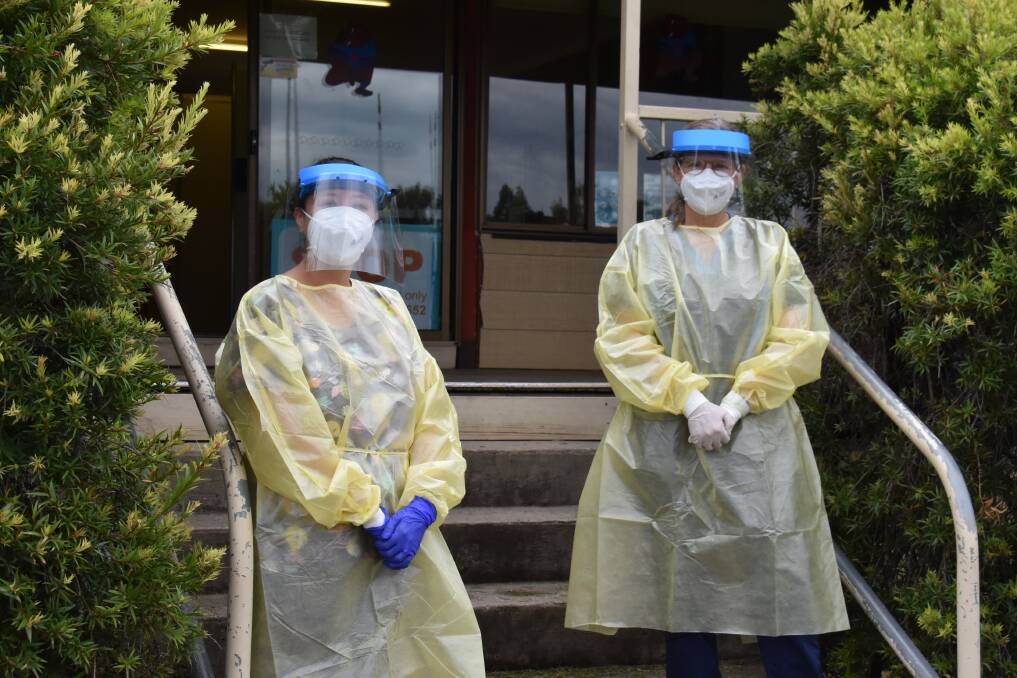 COVID: Dr Chiyo Stent and nurse Tamara Gilbert dressed in PPE outside of the Mudgee Respiratory Clinic at Jubilee Oval. Picture: JAY-ANNA MOBBS