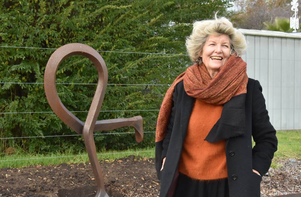 Sculptures in the Garden founder Kay Norton-Knight in front of 'Runner' by Franois Jaggi (Armidale) which has been added to the Lawson Park Sculpture Walk. Picture: Jay-Anna Mobbs