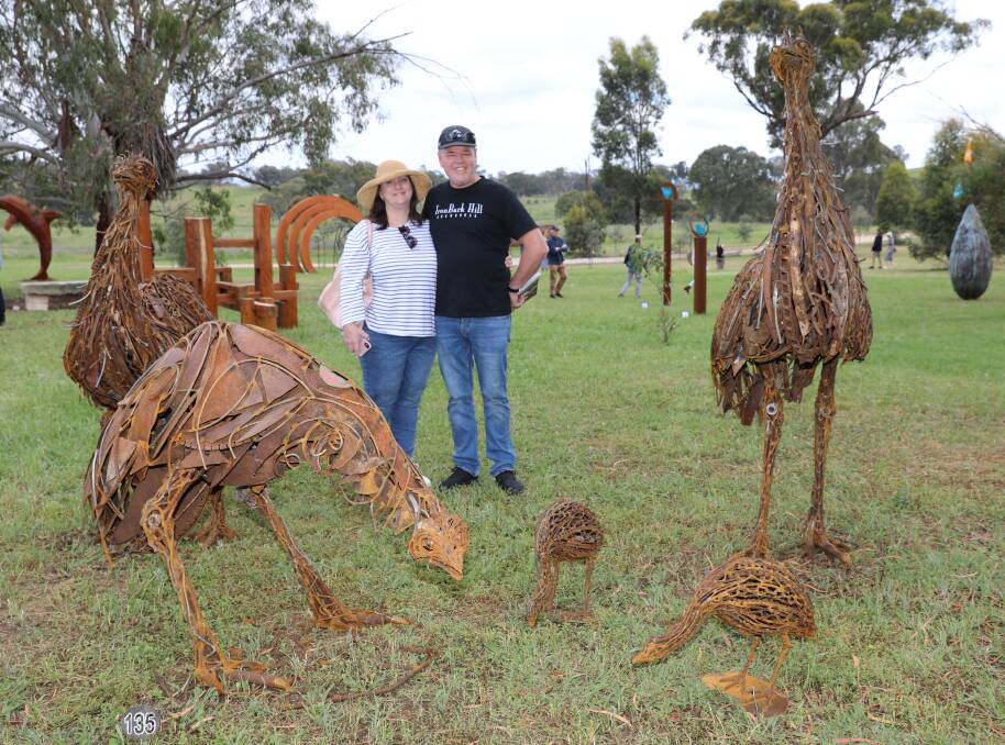 Peter and Wendy Dawson admire Stuart Taylor's Emus at the 2021 Sculptures in the Garden event. Picture: Simone Kurtz