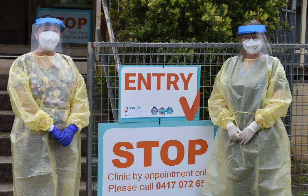 VACCINE: Dr Chiyo Stent and nurse Tamara Gilbert dressed in PPE outside of the Mudgee Respiratory Clinic at Jubilee Oval in January 2022. Picture: Jay-Anna Mobbs