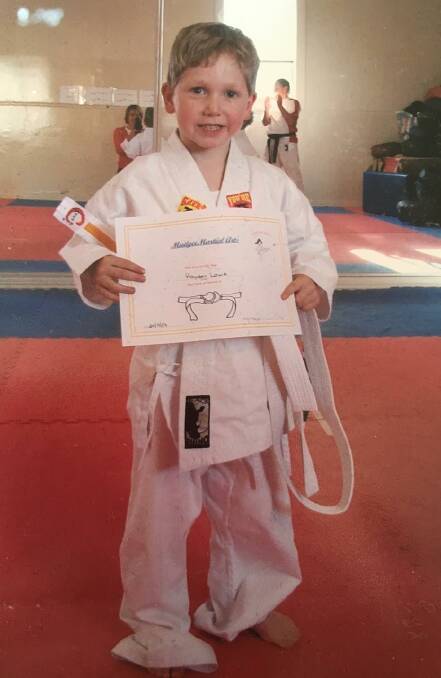 YOUNGSTER: Hayden Lowe with an award during his early years at Mudgee Martial Arts. Picture: SUPPLIED
