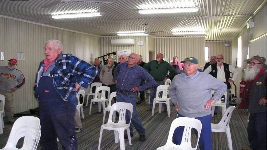 GET MOVING: 25 socially distanced men at the Shed doing what they are told. Photo: Supplied