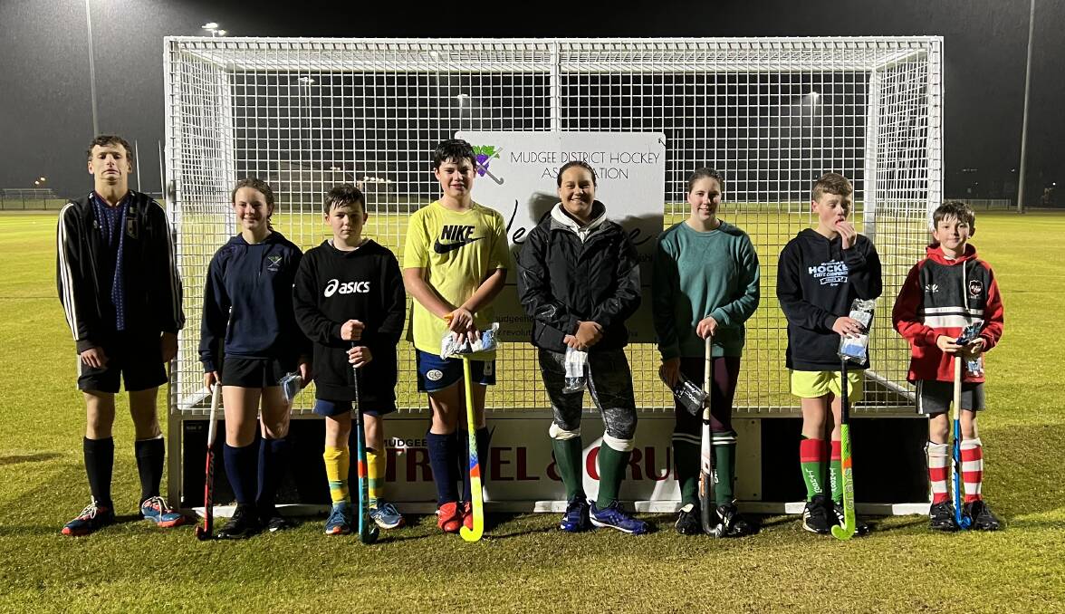 Alex Walker-Cooke, Melanie Pratt, Angus Marchant, Innes Flagg, McKayla Grobler, Georgie Bagget and Noah Caligari in front of Mudgee Hockey net with their gear. Picture: Supplied