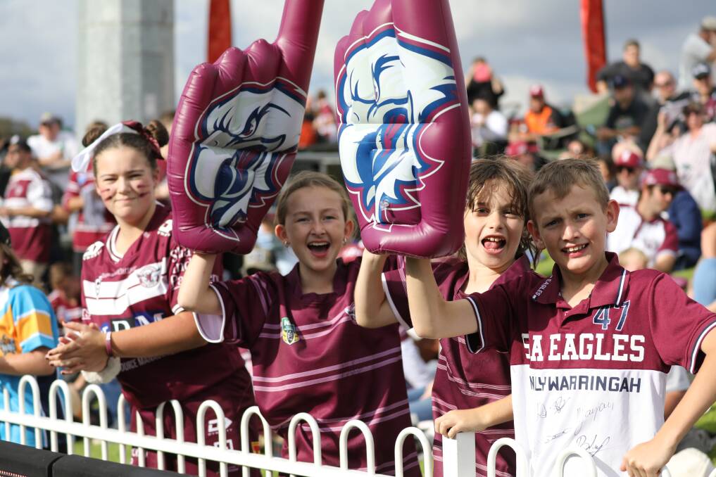 Four young Manly Warringah Sea Eagles show their support at last year's game between the maroon and whites and the Gold Coast Titans. Picture: Simone Kurtz